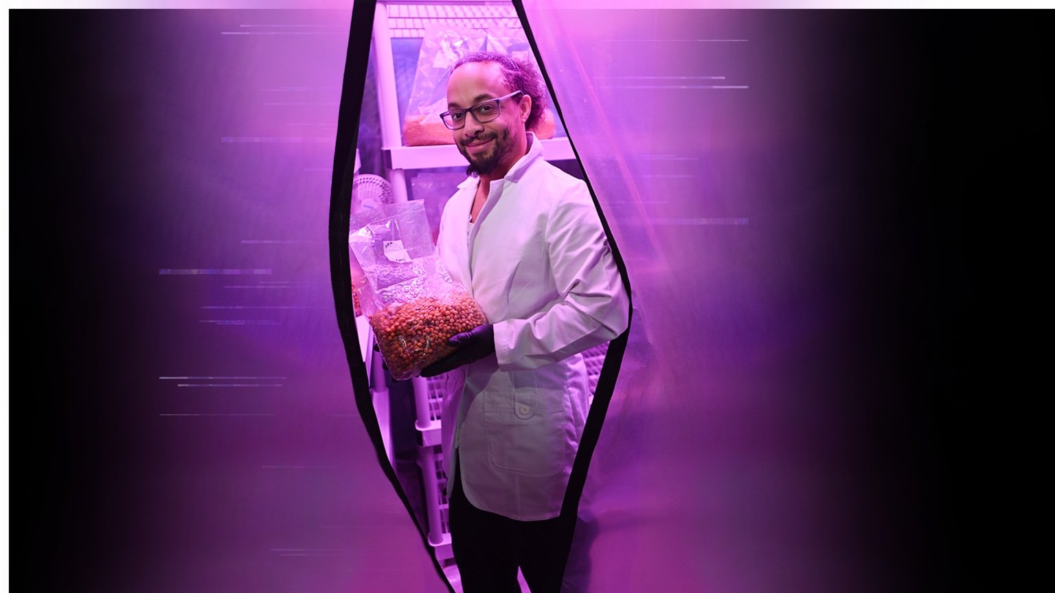 Purple Mystic’s owner holding a growing bag in his growing space